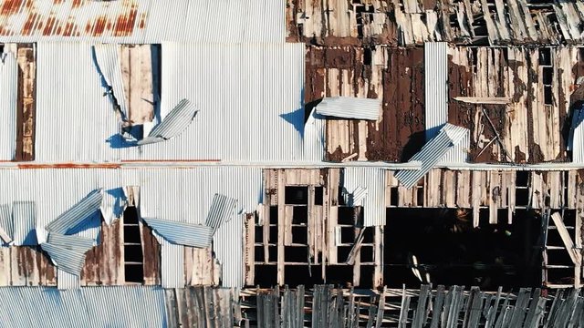Aerial Flyover of Abandoned Sugar Mill Showing Damaged Roof in Longmont Colorado Vertical Video