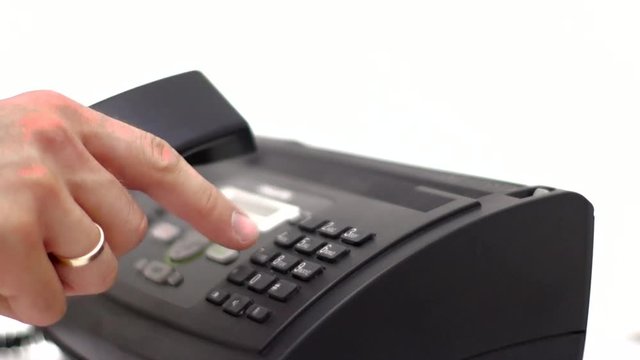 The man is calling, dials the number.