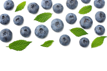 healthy background. blueberries with leaves isolated on white background. top view