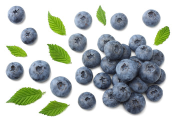 healthy background. blueberries with leaves isolated on white background. top view