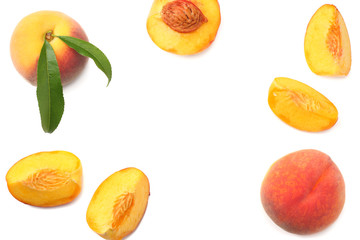 peach fruit with green leaf and slices isolated on white background. top view