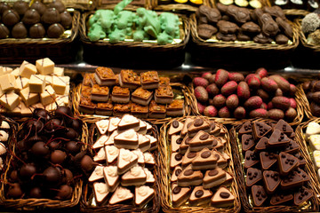 Famous sweet candy market .Confectionery at Boqueria market place in Barcelona, Spain. Assorted chocolate candy shop.