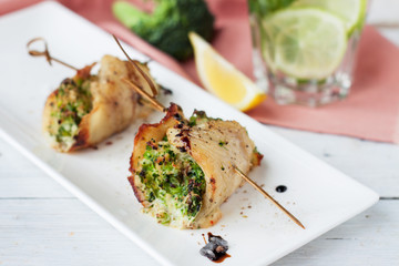 White fish roulades stuffed with broccoli and asparagus