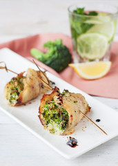White fish roulades stuffed with broccoli and asparagus