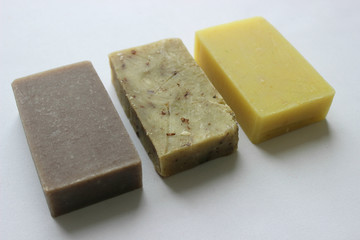 Natural handmade soap yellow, green and gray isolated on white background