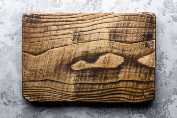 Old oak wood board on rustic concrete table. Food photography