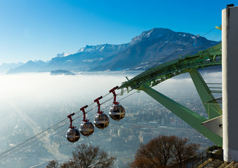 Cityscape with cable cars in Grenoble in autumn, France