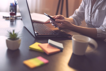 Businesswoman typing text message