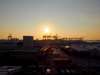 Aerial view of Sunset, Shipping Cranes, and Honolulu cityscape