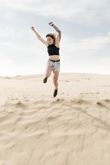 Woman in the desert pushed to jump up