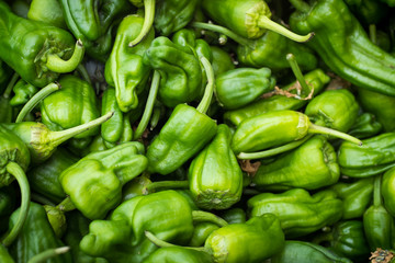 Obraz na płótnie Canvas Medium close up of fresh green peppers at the Clement Street Farmer's Market in San Francisco.