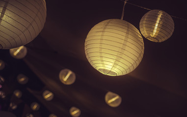 Shining lampions on a ceiling