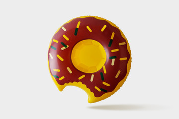 Inflatable donut pool toy on white background. Minimal summer concept.