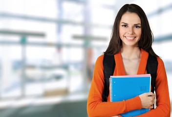 Young Female College Student on background