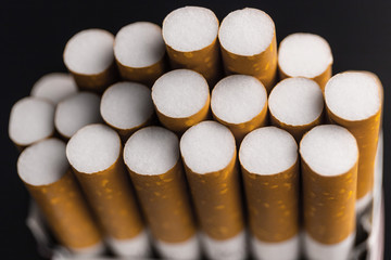 Close up pack of filtered cigarettes. Quitting smoking is the single easiest way to avoid heart...