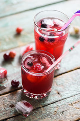 Healthy summer soft drink. Cherry sangria in glasses with berries and ice