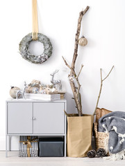 Stylish interior with Christmas decor and presents.