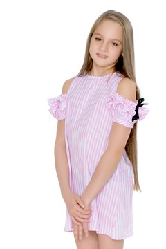 A teenage girl in a short dress.