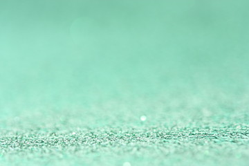 Obraz premium Cyan background with glitter.