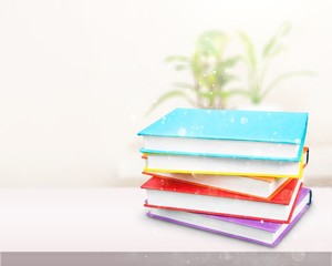 Colorful books collection on white table
