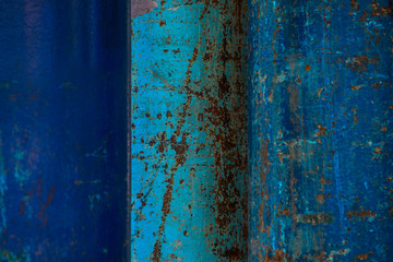 Abstract surface of rusty blue pipes