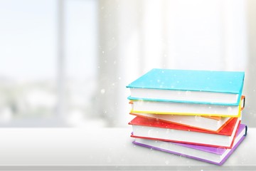 Colorful books collection on white table