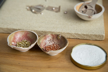 Jeweller's tools - pliers, cutters, carving knives, moulds, raw silver  pieces, engraver, sander, jeweler's bench pin