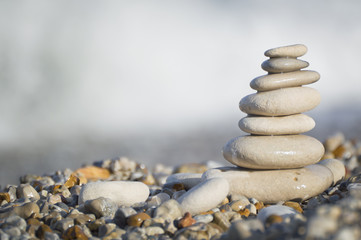 Fototapeta na wymiar Stack of stones on beach