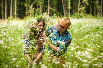 Fototapeta premium happy young couple in the woods