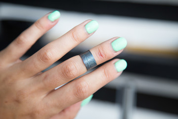 The process of making silver jewellery. Female artist hands close up. Crafting a silver ring, see the entire series.