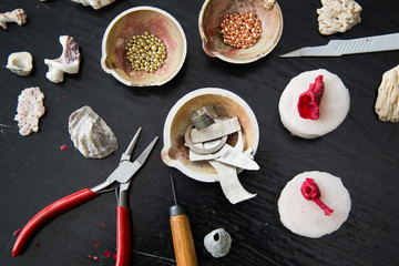 The process of moulding silver jewellery with natural objects like seashells with jeweller's wax