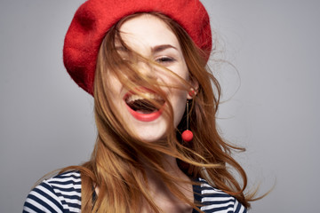 happy woman in beret smiling earrings portrait emotions joy