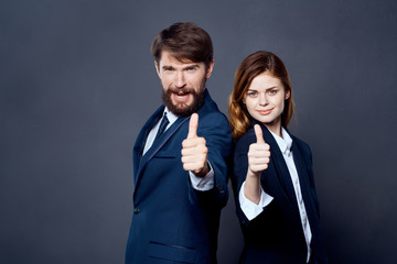 business colleagues thumbs up signs