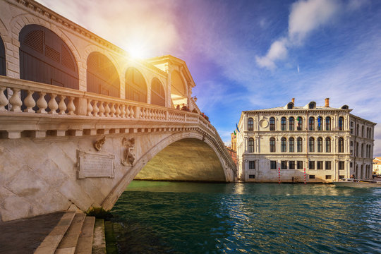 Rialto bridge in Venice, Italy. Venice Grand Canal. Architecture and landmarks of Venice. Venice postcard with Venice gondolas