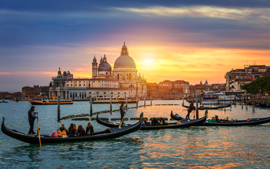 Naklejka premium Grand Canal with gondolas in Venice, Italy. Sunset view of Venice Grand Canal. Architecture and landmarks of Venice. Venice postcard