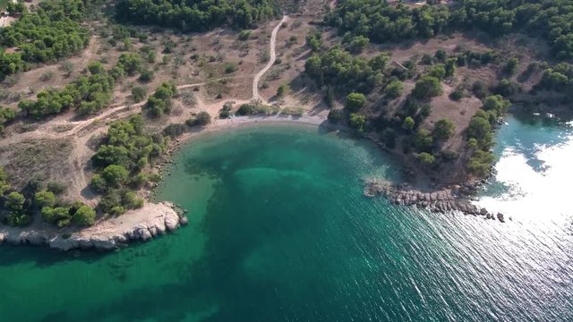 Aerial shot of a beach in Tzemi village of the region Ermionida near Porto Cheli in Greece. Small beautifull beach with turquoise water view from above.
