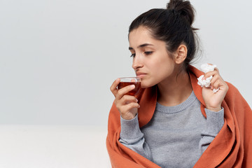 woman drinking hot tea has the flu
