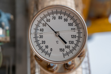 Analog temperature gauge for reading discharge temp of compressor at offshore oil and gas wellhead...