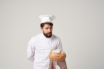 cook with a loaf in the kitchen