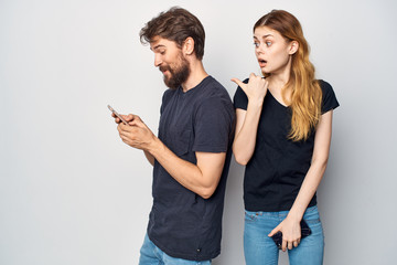 man with phone, woman surprised style