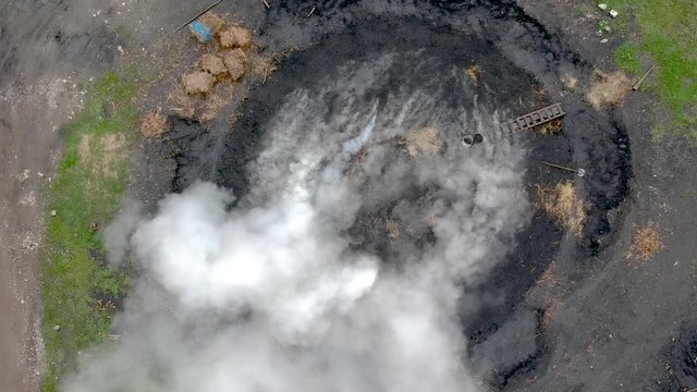 Charchoal burning in a forest - drone footage