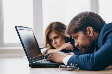 business colleagues are looking at a laptop