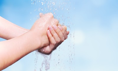 Man washing hands in clean water