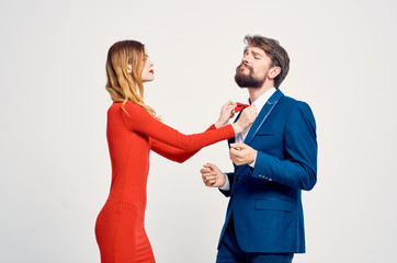 woman straightens tie man