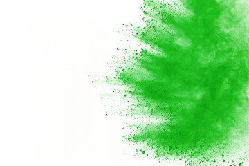 Green powder explosion on white background. Colored cloud. Color dust explode. Paint Holi.