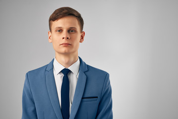 portrait of a serious business man on a light background