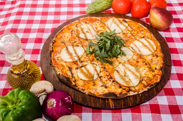 handmade pear pizza prepared on a clay furnace pizza