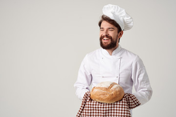 the cook smiles holds a loaf