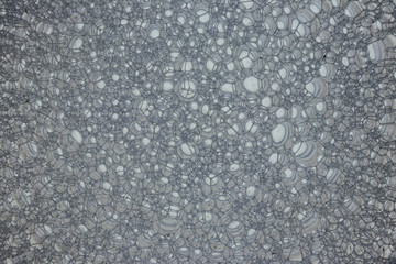 background. defocusing. soap foam is filled with gray