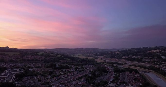 Wide sunset aerial across the beautiful city of Exeter, Devon. With a variance of pastille colours. Panorama, glorious view